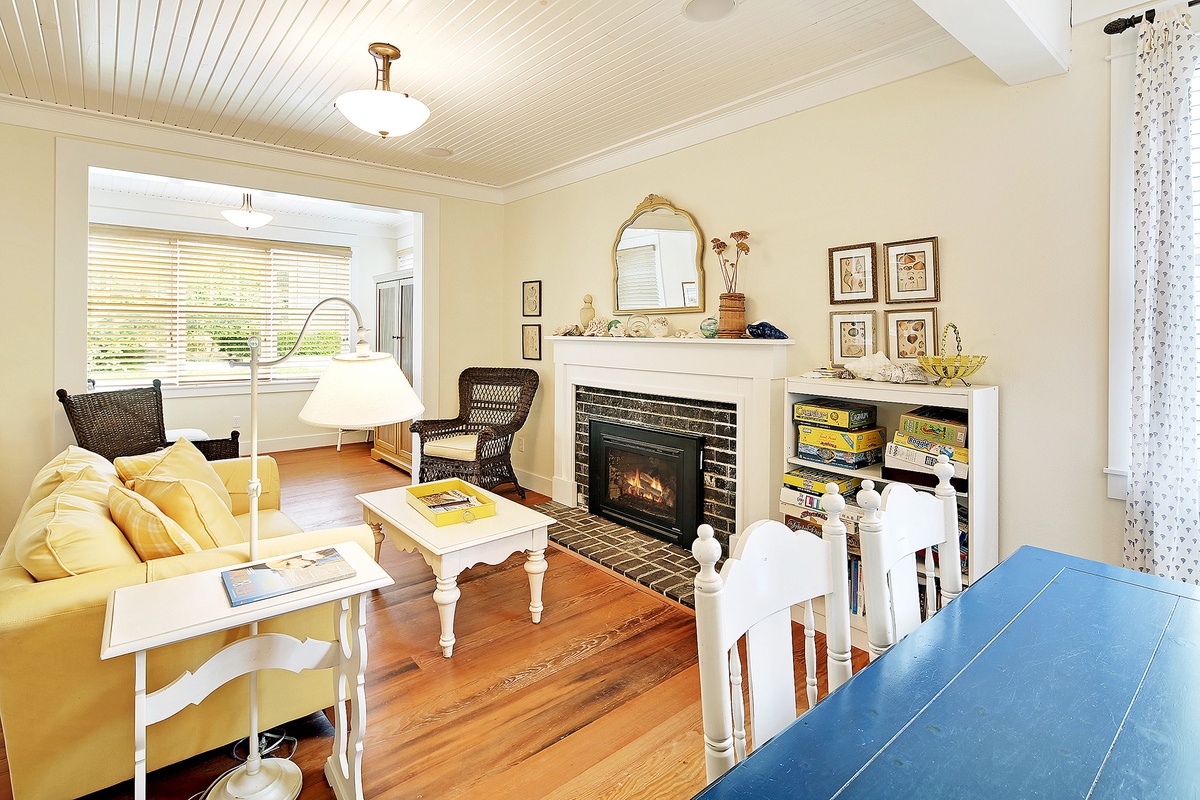 Open main floor with hardwood floors and gas fireplace