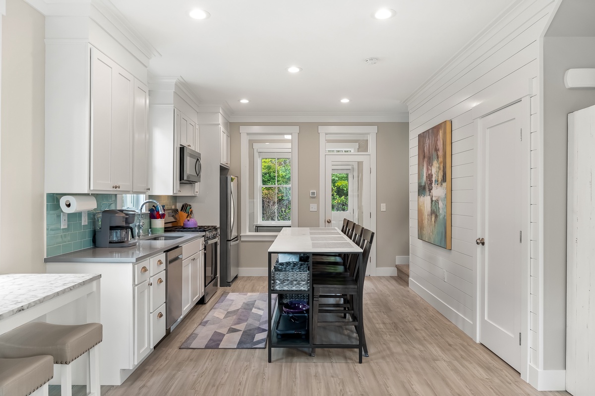 The kitchen is flooded with natural light