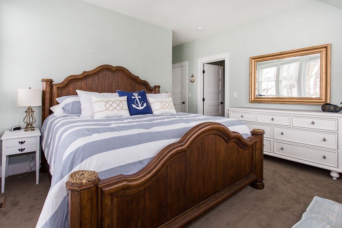 King primary bedroom with dresser