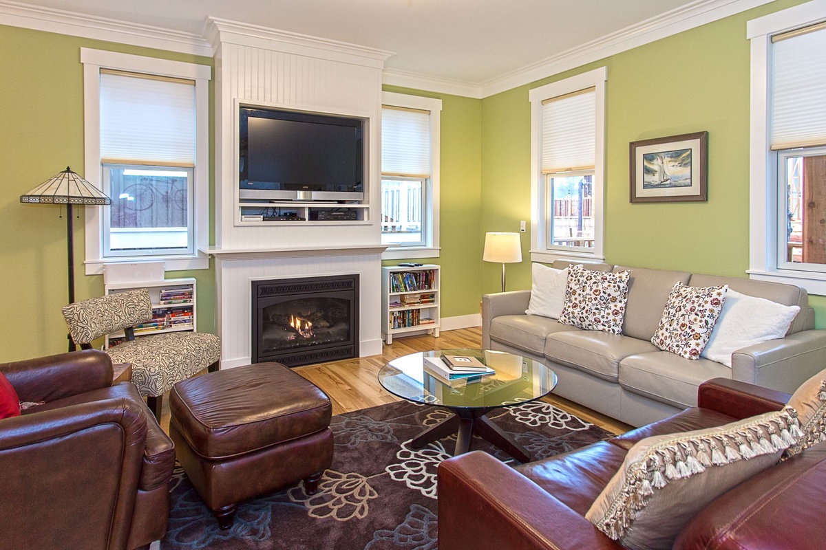 Living room with fireplace and tv