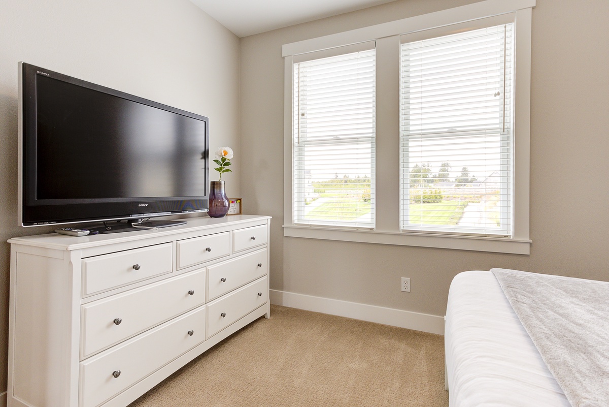 The primary bedroom has beautiful park views