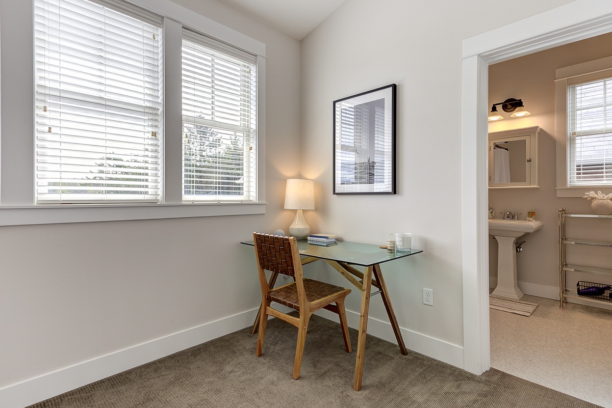 Primary bedroom with desk