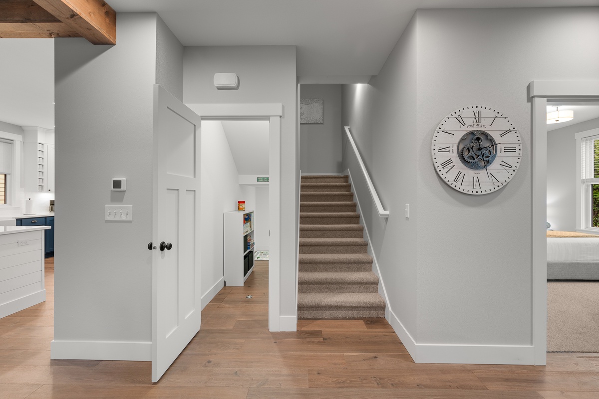 Well-stocked game closet under the stairs