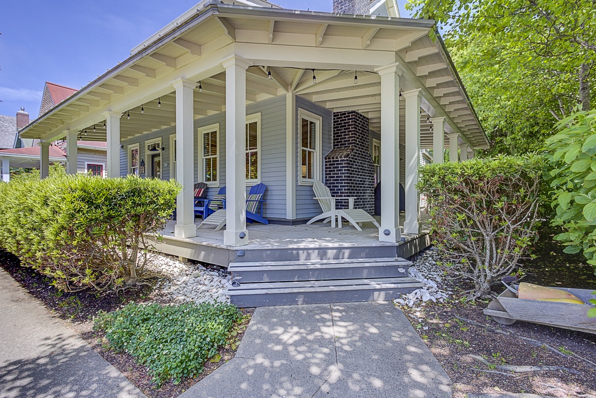 Covered front porch with view of Crescent Park