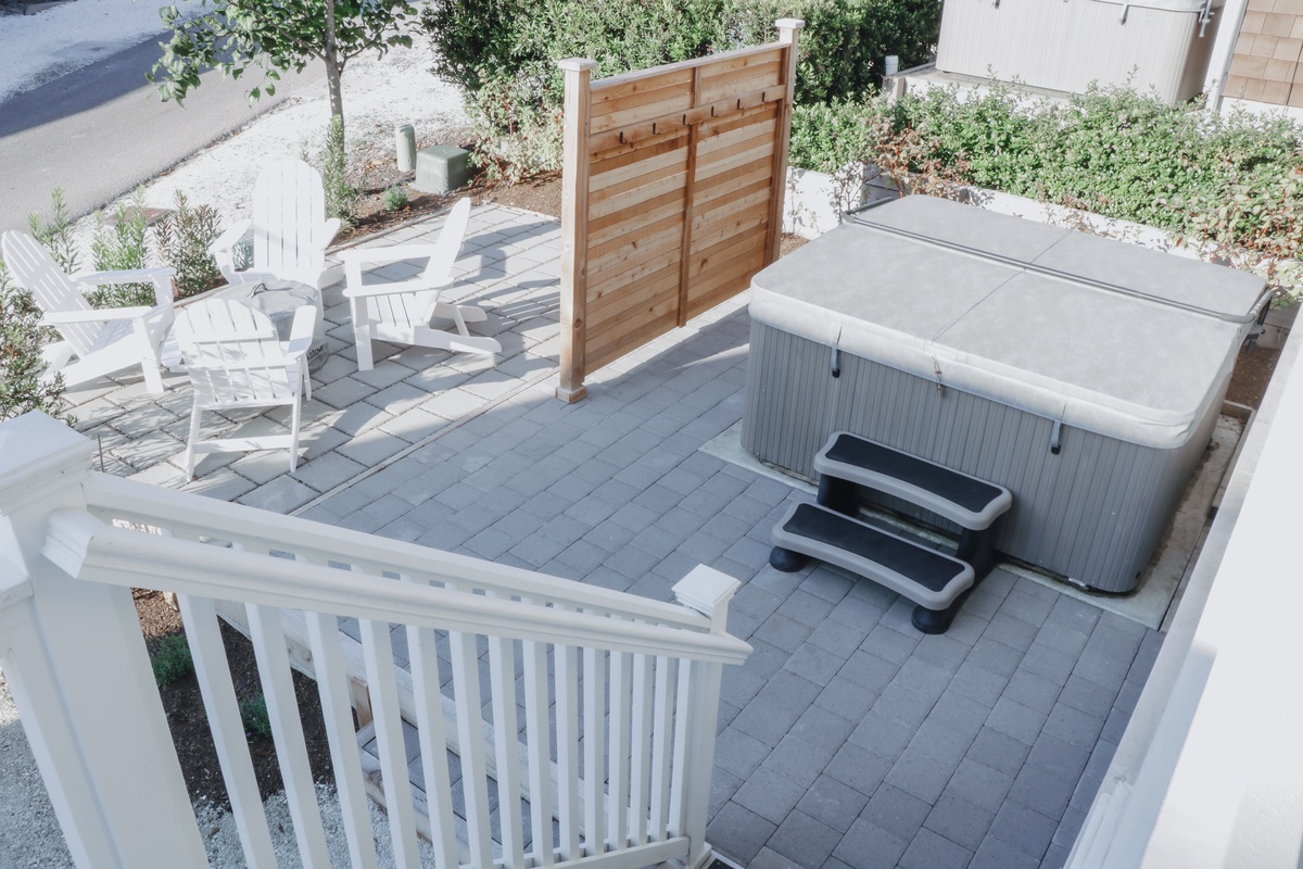 Backyard with hot tub and fire pit