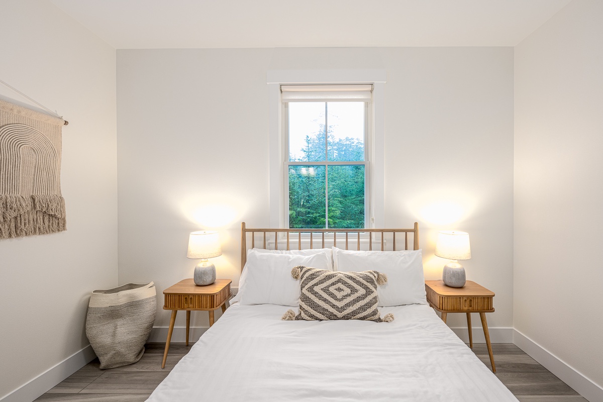 The queen room has tranquil forest views