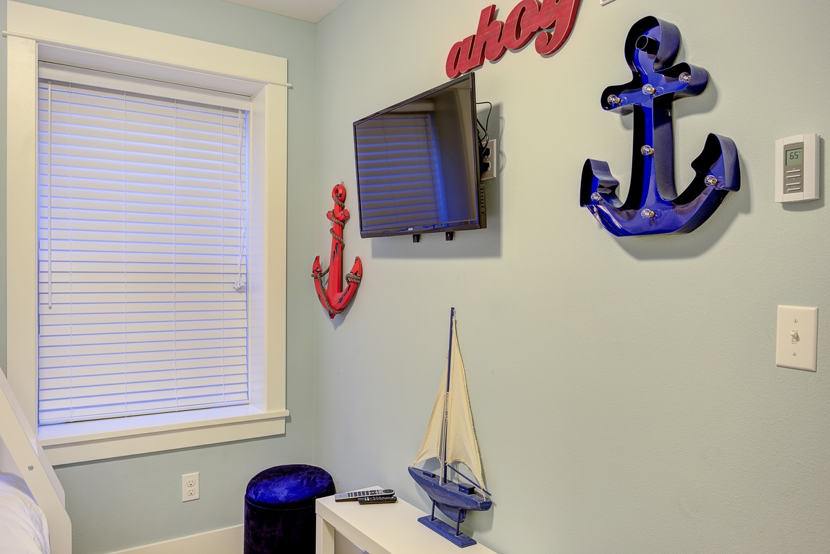 Bunk room TV offers a little entertainment at the end of a fun day at the beach