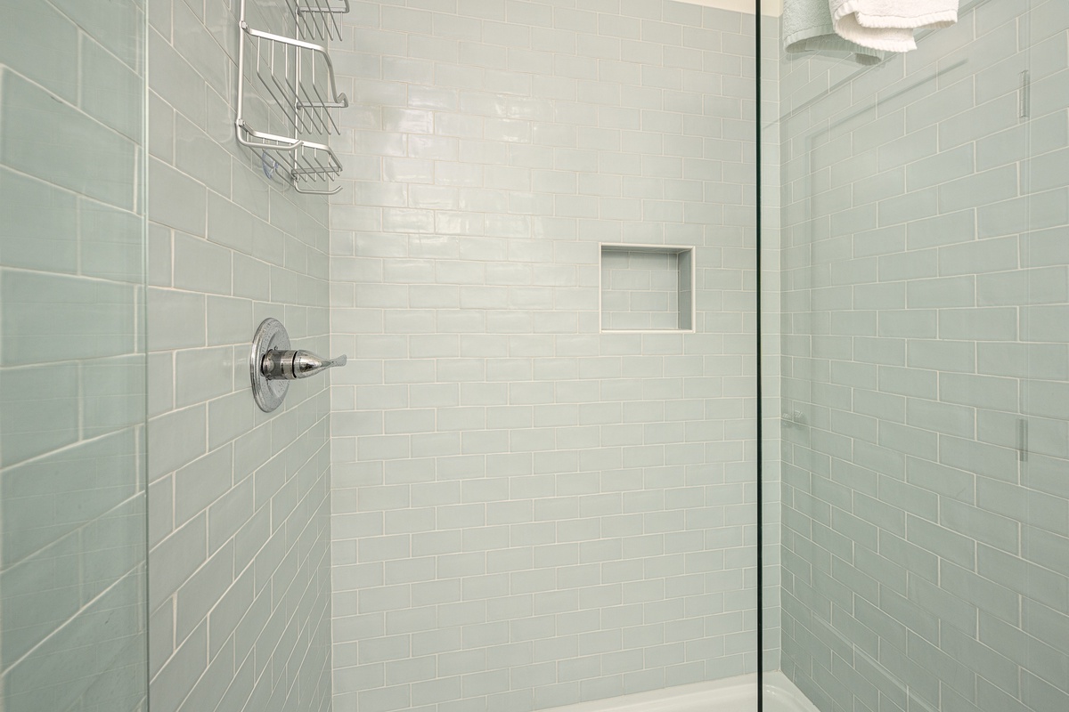 The ensuite bath has a walk-in shower