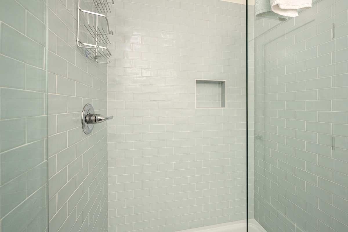 The ensuite bath has a walk-in shower, perfect for freshening up