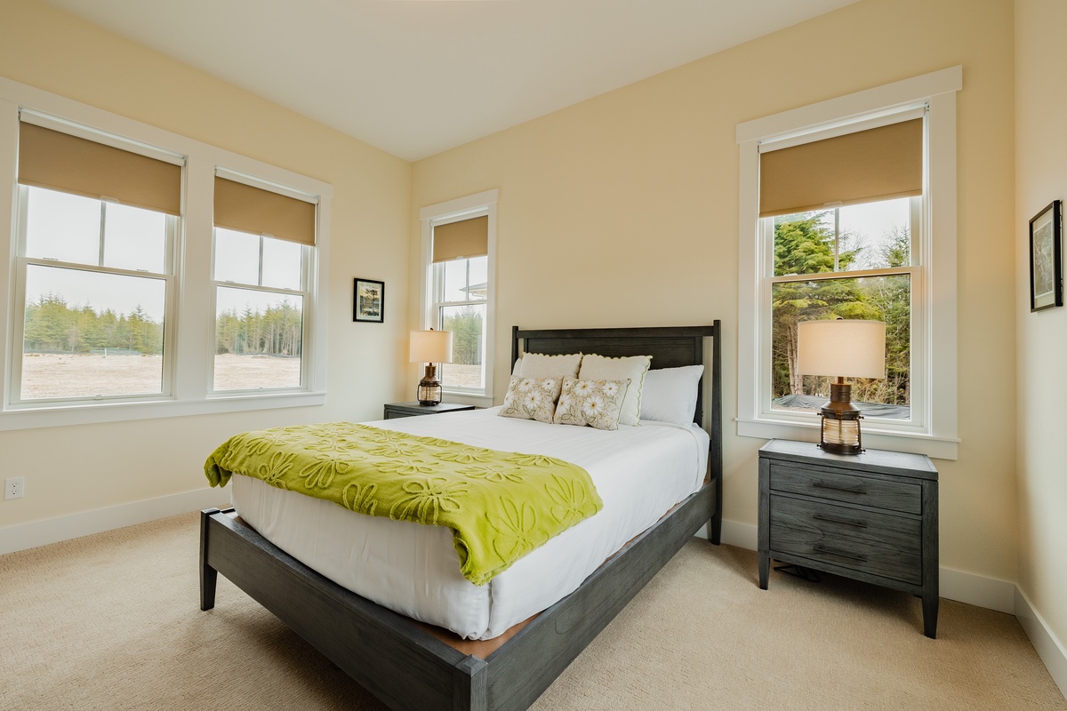 Main floor queen bedroom is designed for rest and relaxation
