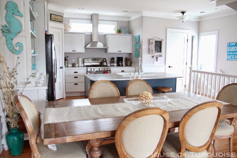 Dining room table seats 8 with 3 additional stools at the kitchen island