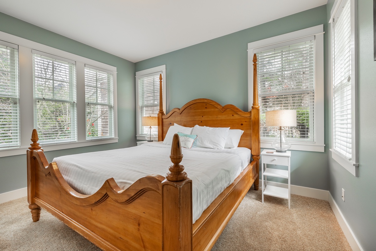 The primary bedroom is designed with relaxation in mind