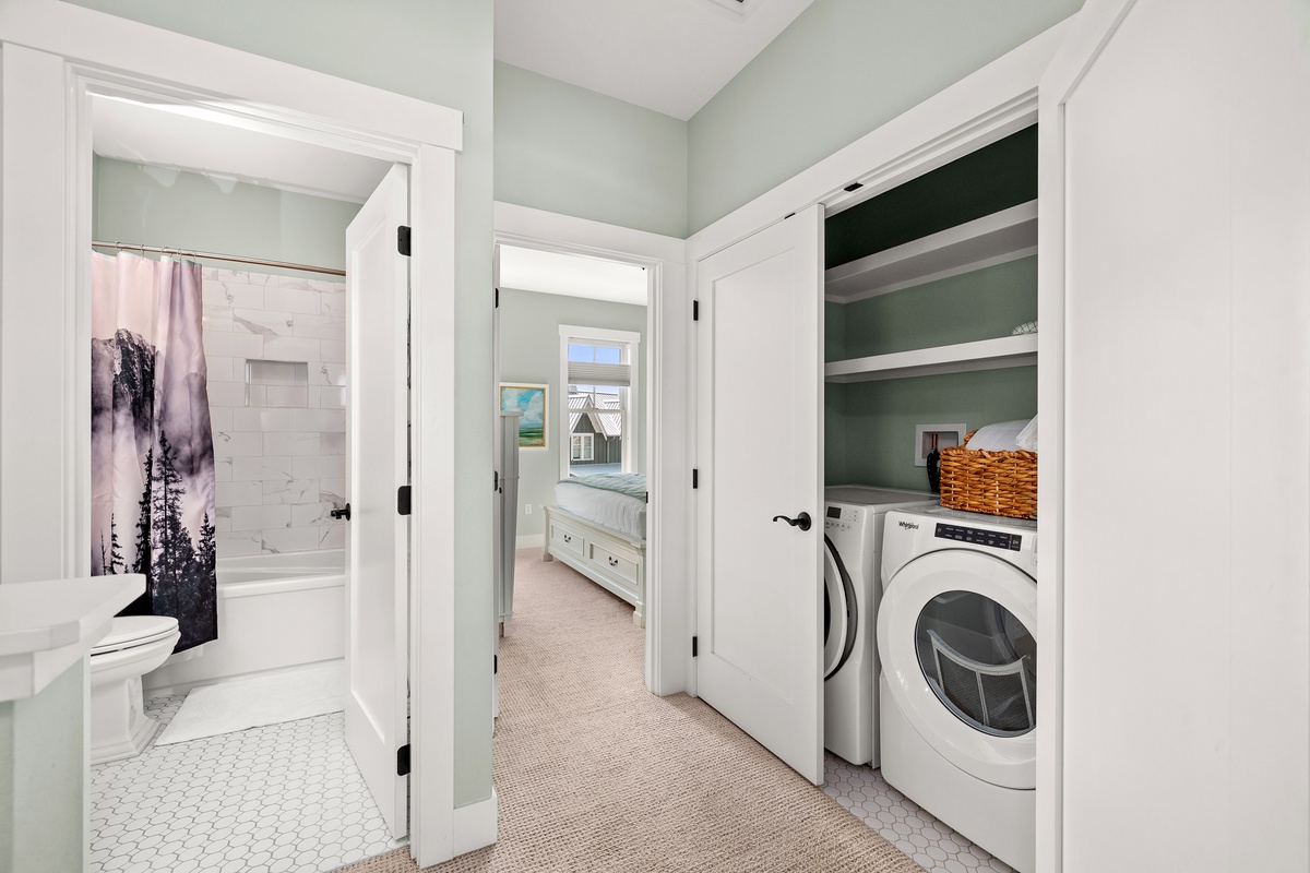 Find the washer and dryer in the upstairs landing
