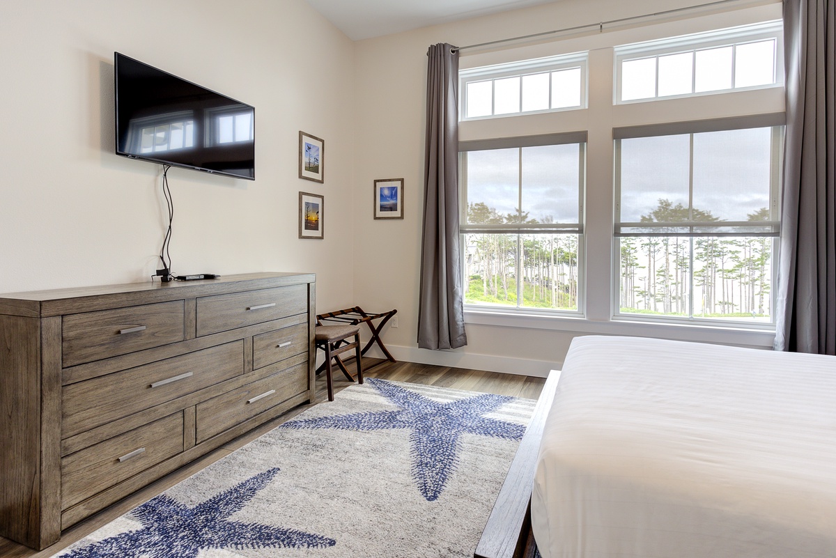 Guest bedroom with soft rugs and a gorgeous view