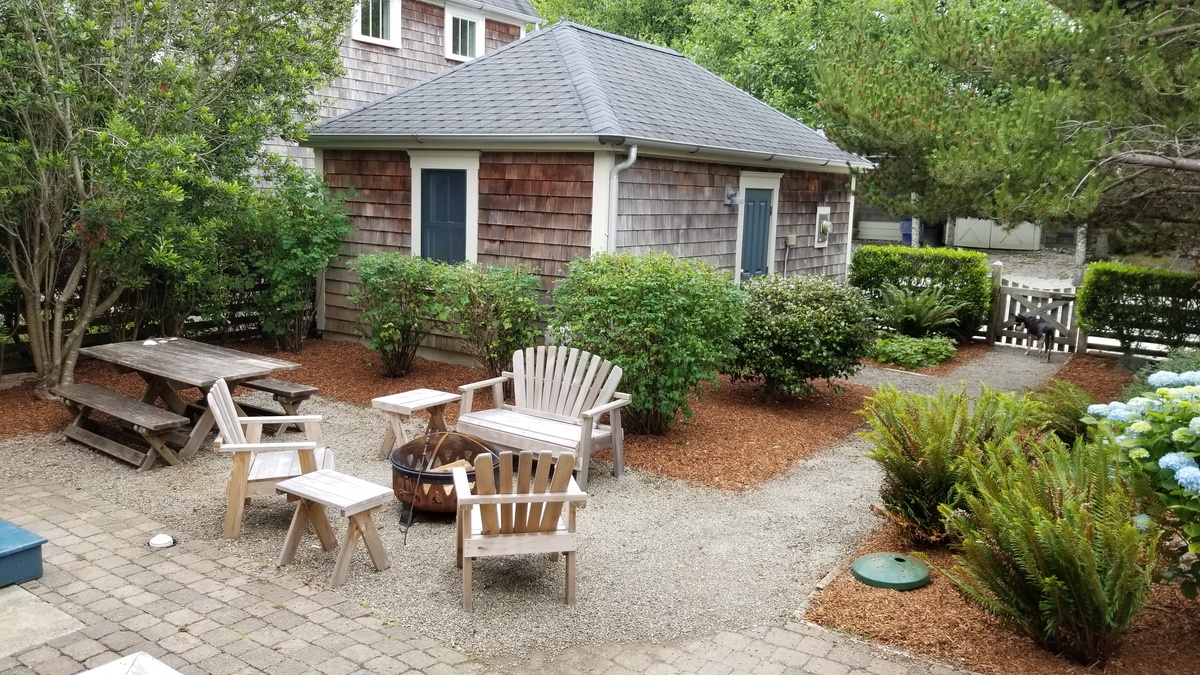 Private yard with fire pit and picnic table