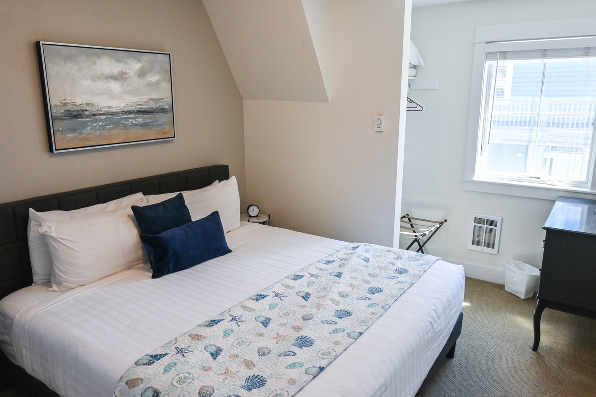 The carriage house bedroom offers comfort and tranquility for a restful stay