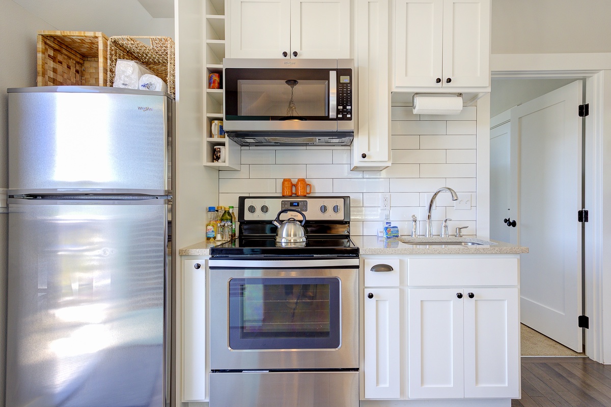 The full kitchen has an electric range