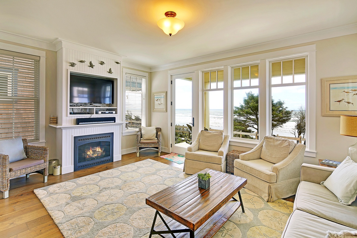 Living room with gas fireplace and tv