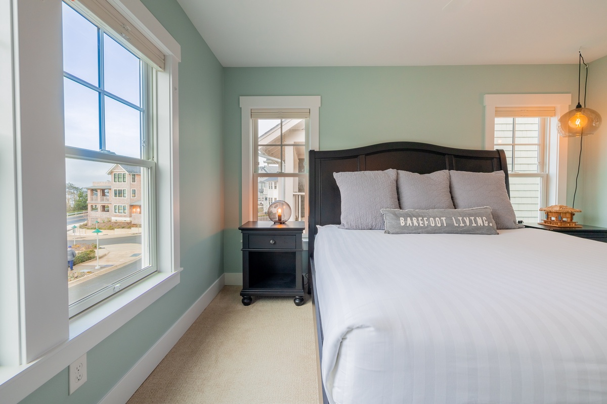 Primary bedroom offers ocean views