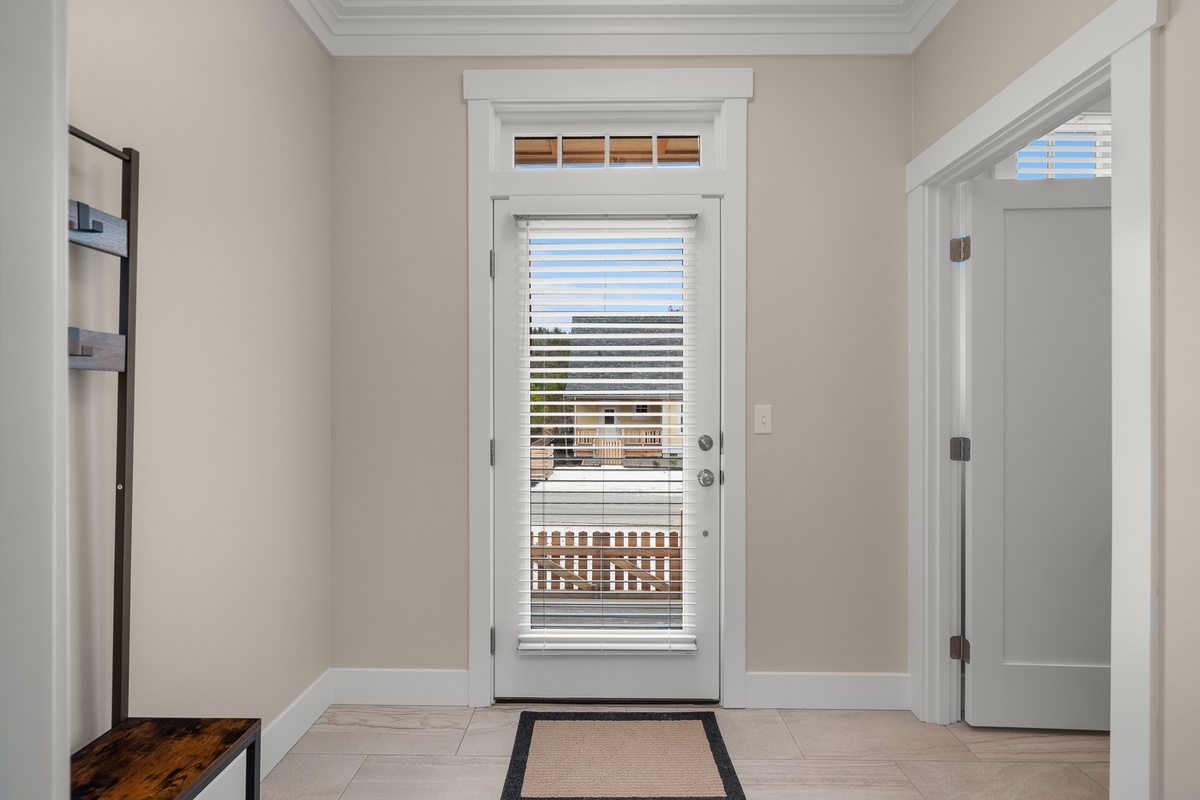 The mudroom leads out to the back yard