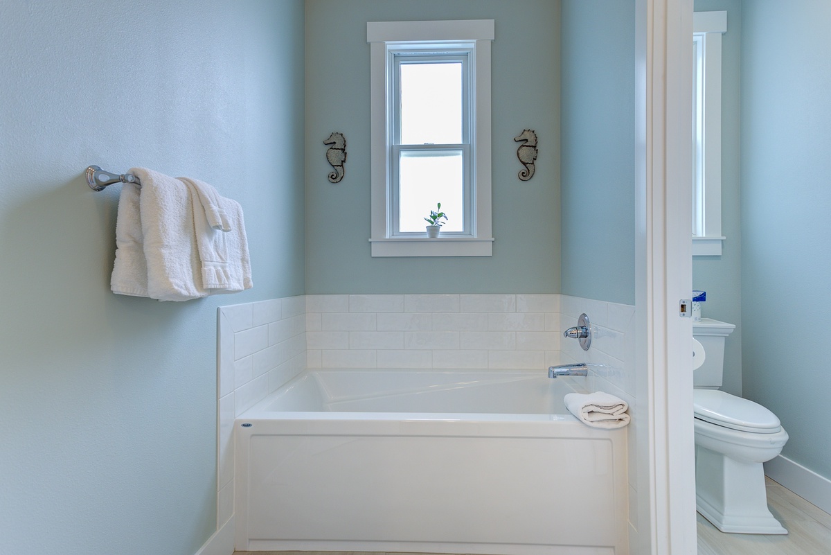 The primary ensuite bathroom has a soaking tub