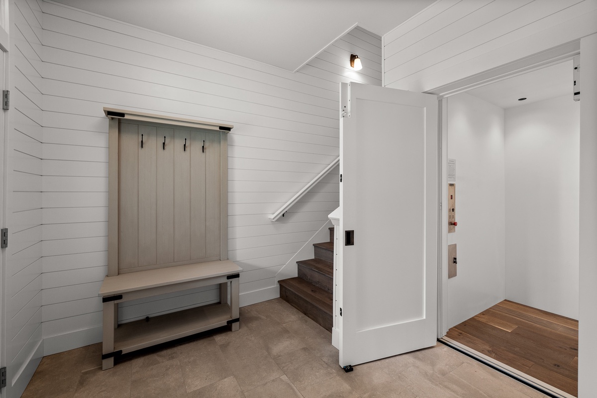 Mudroom with elevator access