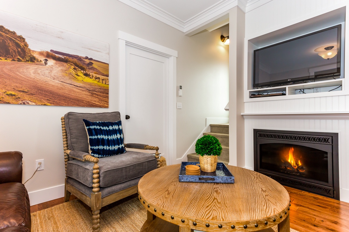 Snuggle on the couch in front of the gas fireplace
