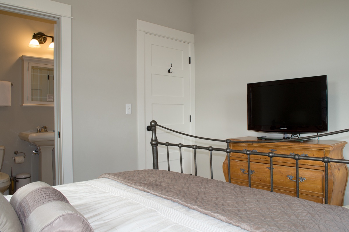 Primary bedroom with flat screen TV