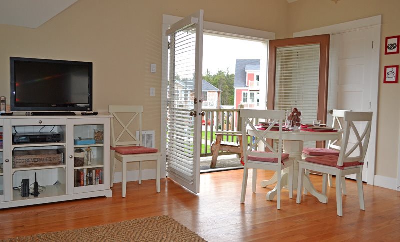 Carriage House dining table in front of the private balcony