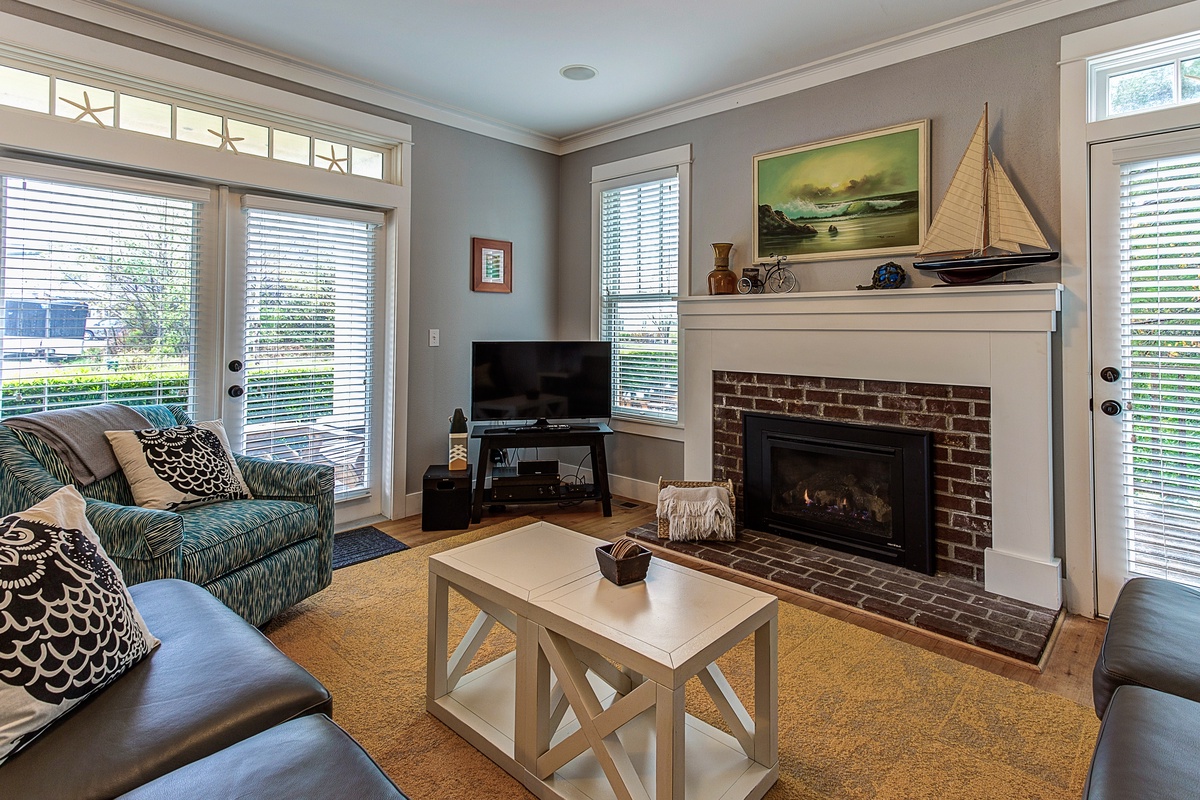 Living room with fireplace and tv