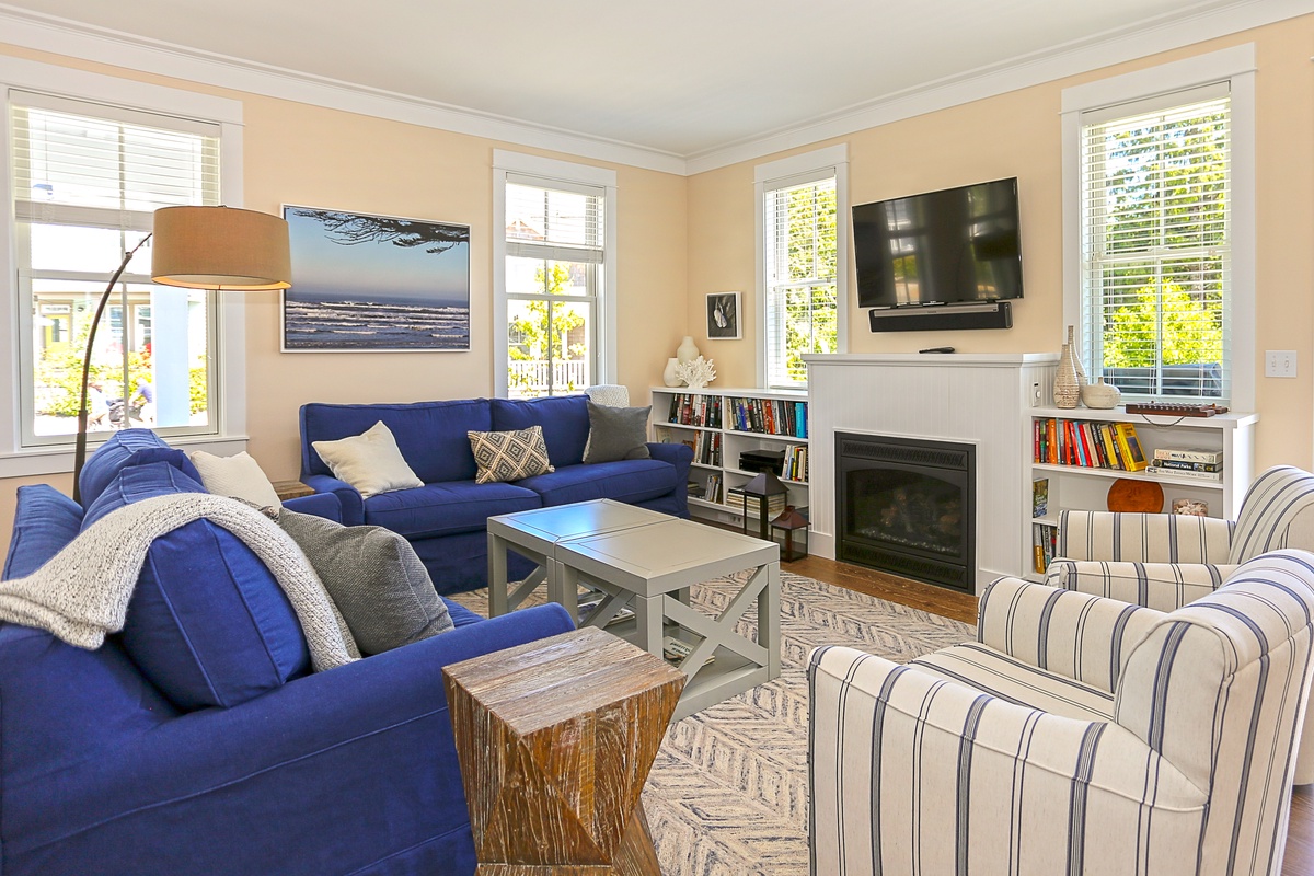 Living room with gas fireplace, tv, and books