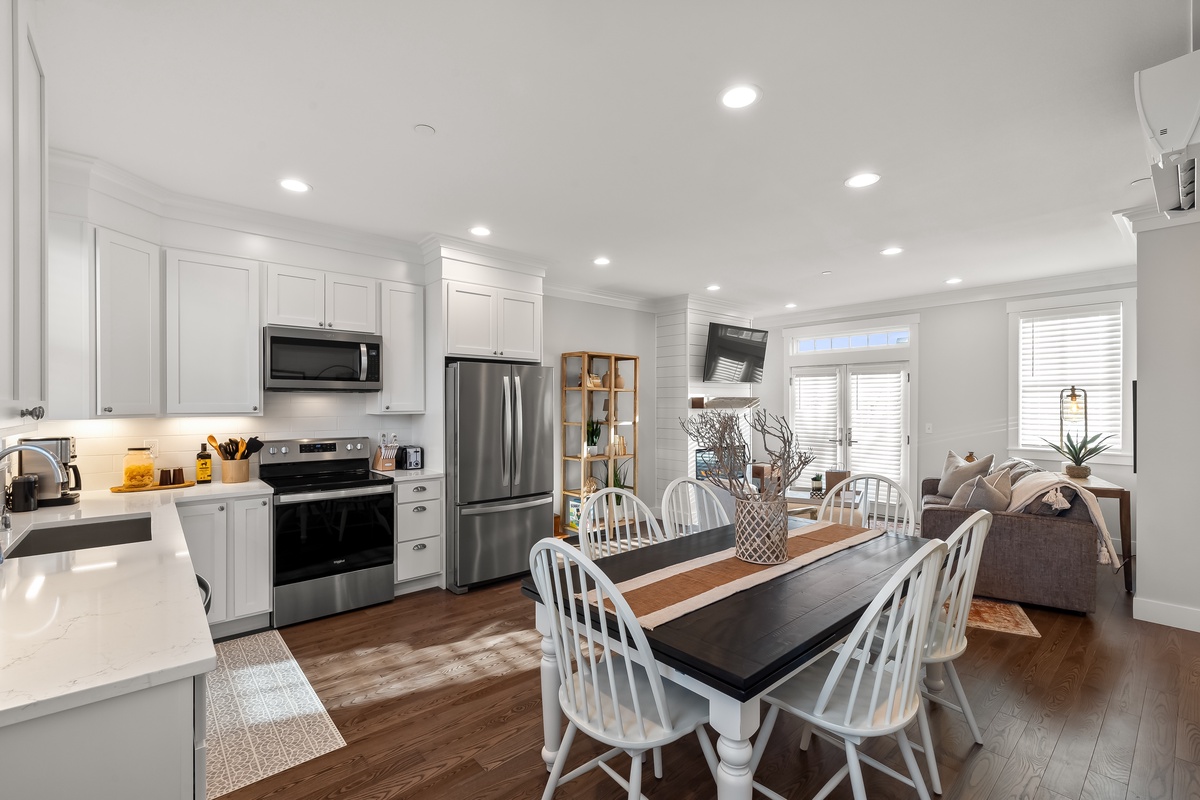 Dining room directly off the kitchen keeps everyone together during meal prep