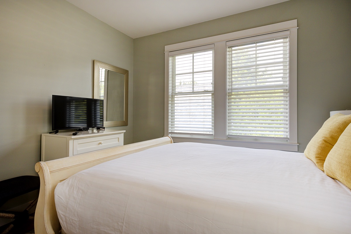 The guest bedroom is designed with relaxation in mind