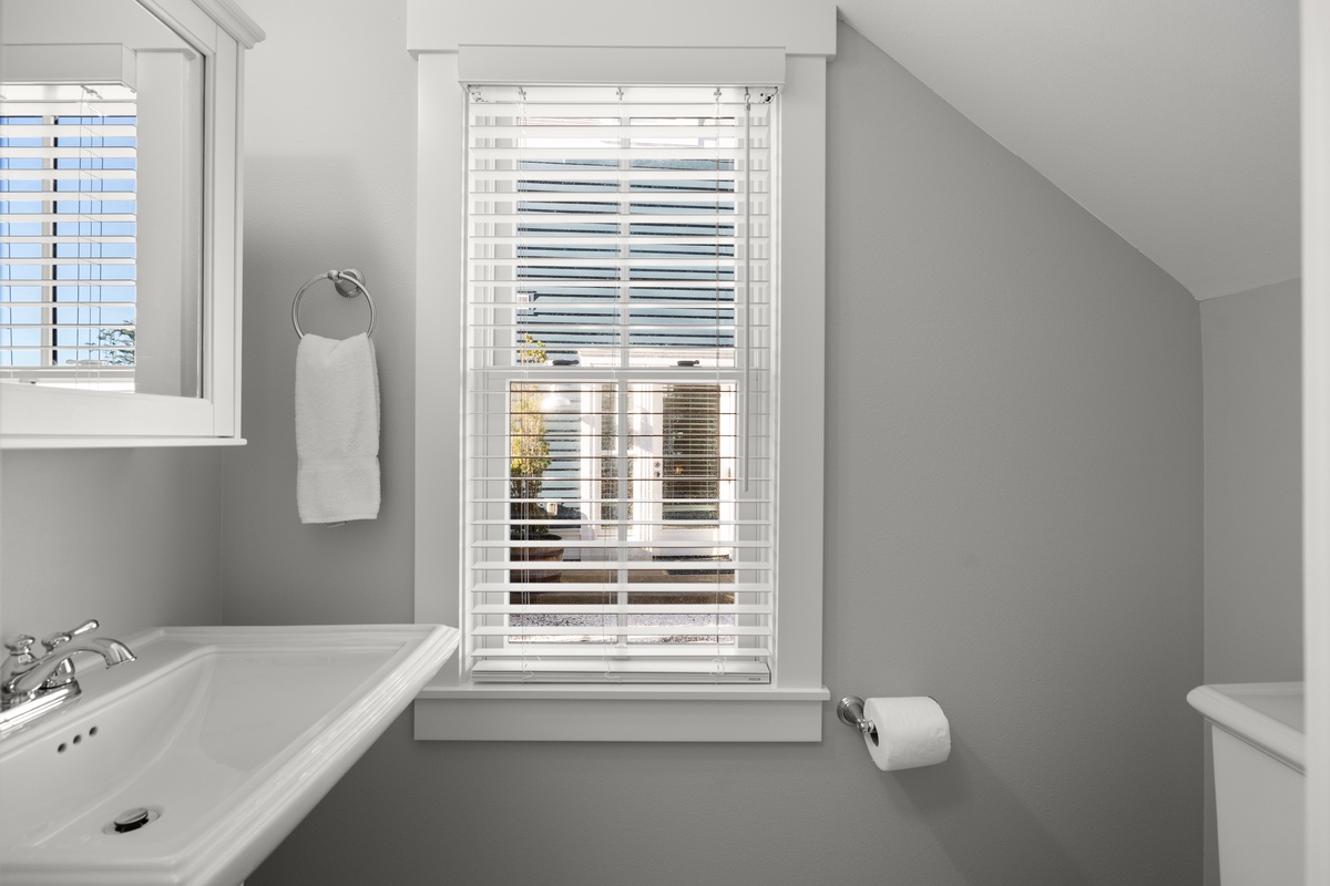 Lower level half bath offers convenience from the ground level entry