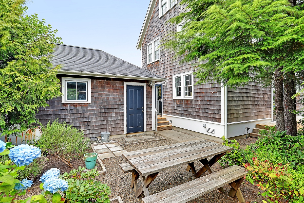 Courtyard with picnic table and fire pit	