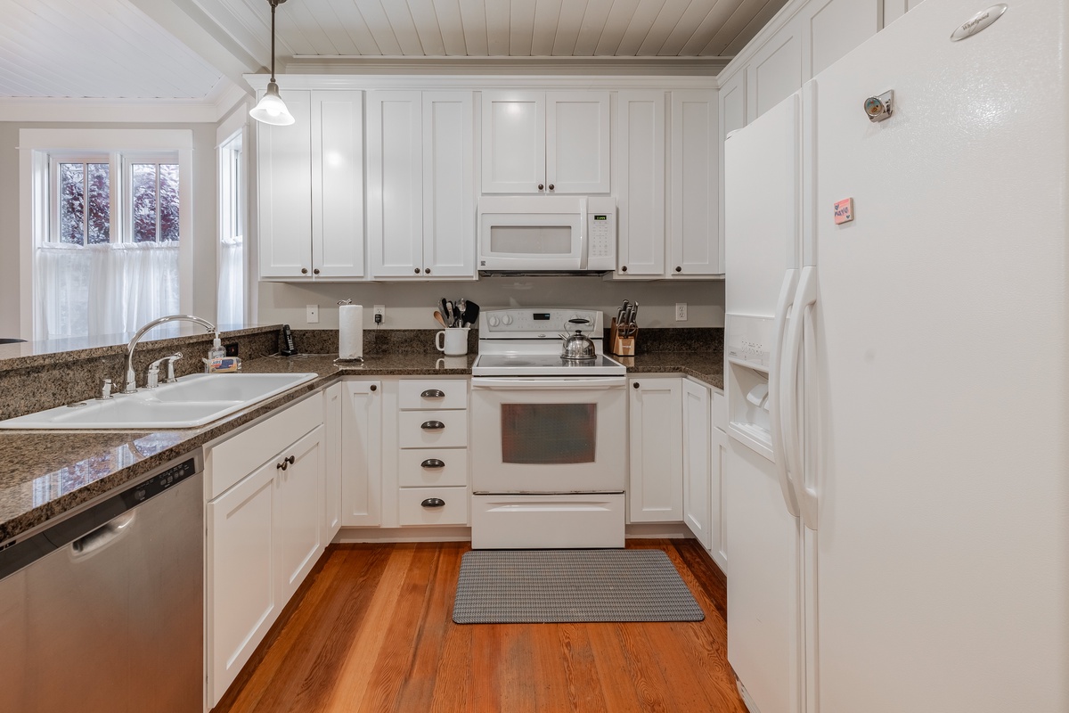 The fully equipped kitchen is ready for your culinary creations