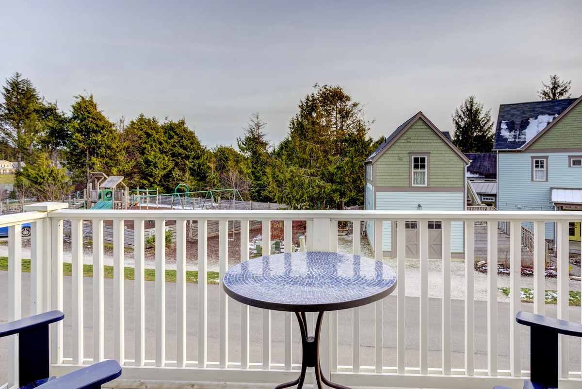 Second floor primary bedroom balcony with playground view