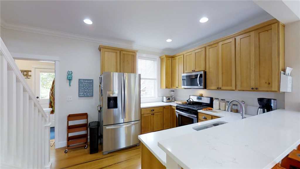 Full kitchen with stainless steel appliances