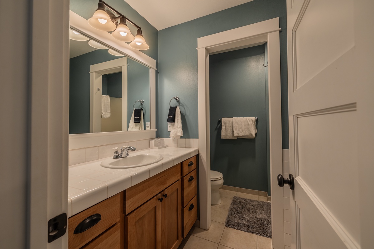 The ensuite bathroom offers a spa-like retreat
