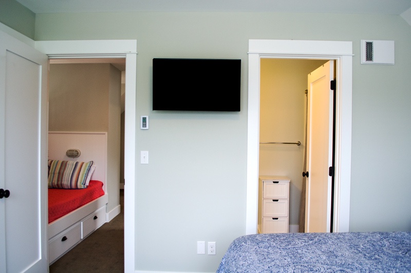 Upper Level - primary King Suite with private bathroom and flat screen TV