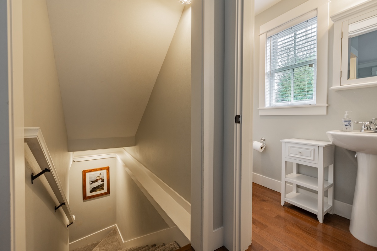 Stairs down to more bedrooms