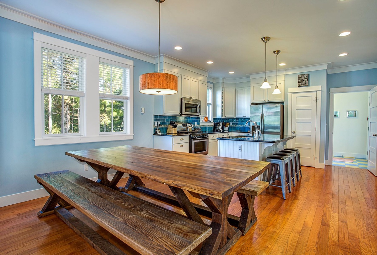 Substantial table, made from reclaimed homes in Belle Chasse, LA, greets as many as 10 guests