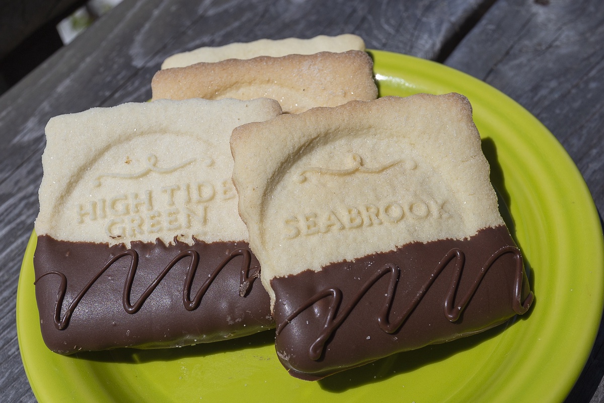 Enjoy the provided chocolate-dipped cookies