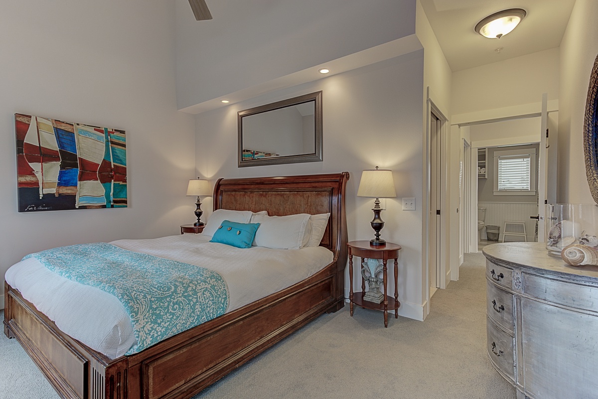 Primary king suite, with flat screen TV has two private doors opening to a nice ocean breeze and a view above Front Street