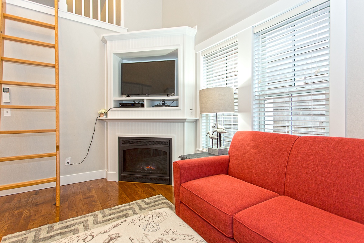 Living room with ladder to loft