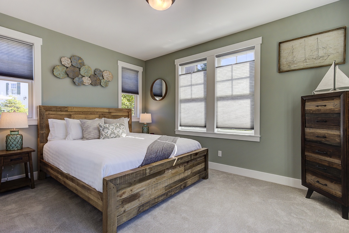 The main floor primary bedroom is designed for relaxation