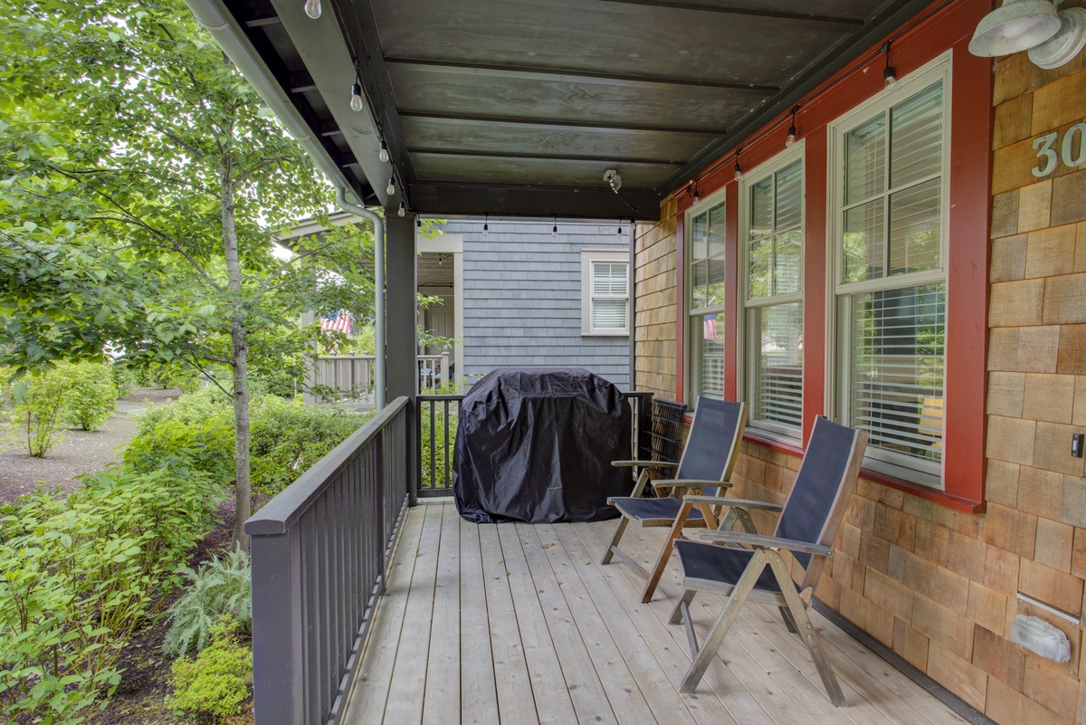 Covered porch with BBQ facing trail