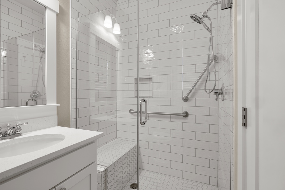 Walk-in shower with bench and grab bars