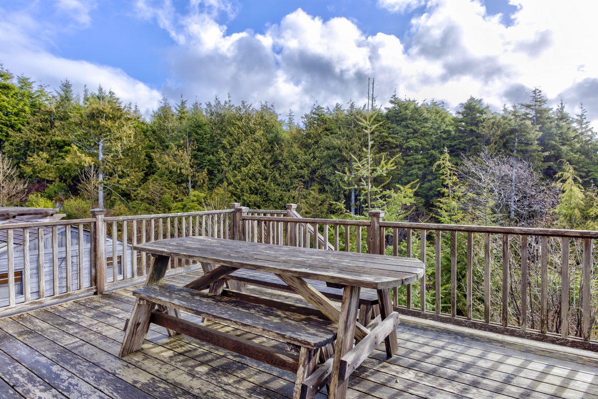 Back deck off the kitchen with outdoor seating