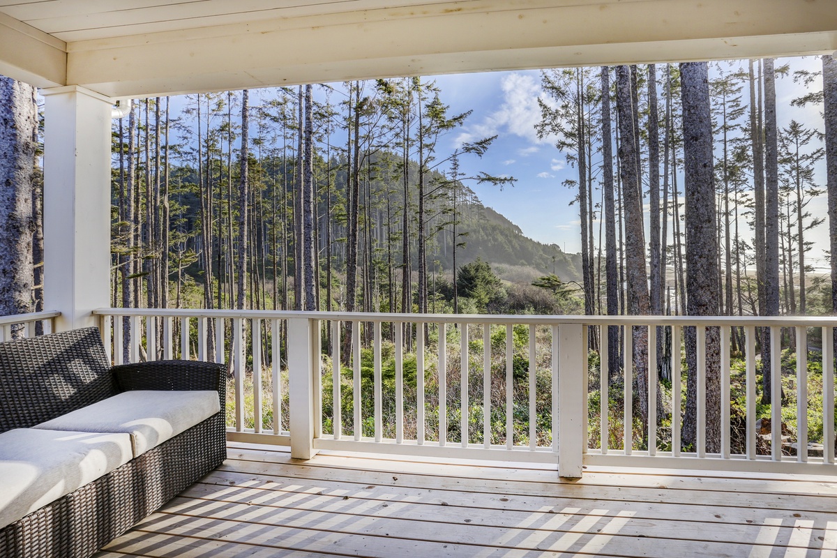 Main level deck with outdoor furniture and ocean view	